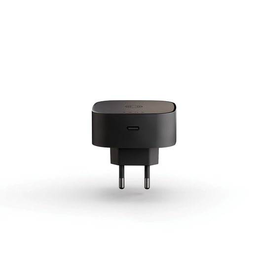 Zens wireless charging adapter for phones and tablets, compact black accessory with a sleek design.
