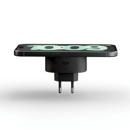 Zens wireless charging adapter for phones and tablets, compact design with USB-C port, black color, in close-up view