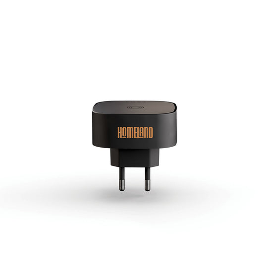 Zens wireless charging adapter for phones and tablets, compact accessory with sleek design, compatible with various devices.