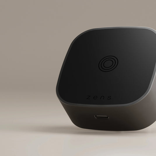 Zens wireless charging adapter for phones and tablets, compact accessory with sleek design and USB-C port.