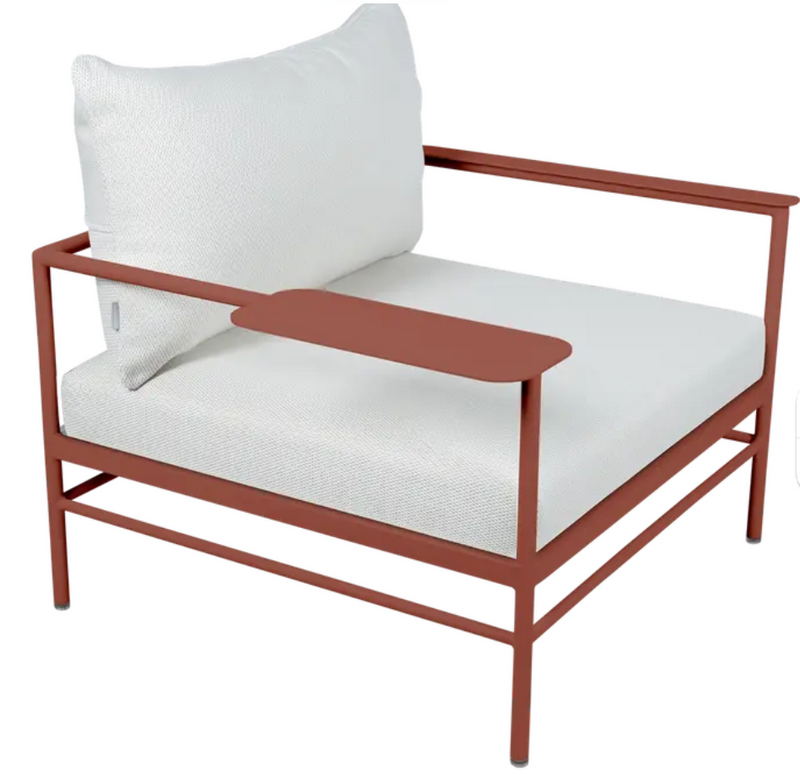 Load image into Gallery viewer, Red ochre Fermob Rivage outdoor metal armchair with low armrests, ideal for garden furniture and outdoor seating.
