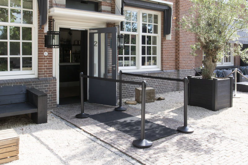 Load image into Gallery viewer, Securit Barriers Systems - Retractable - Coated black 95x6,4x6,4cm - in use
