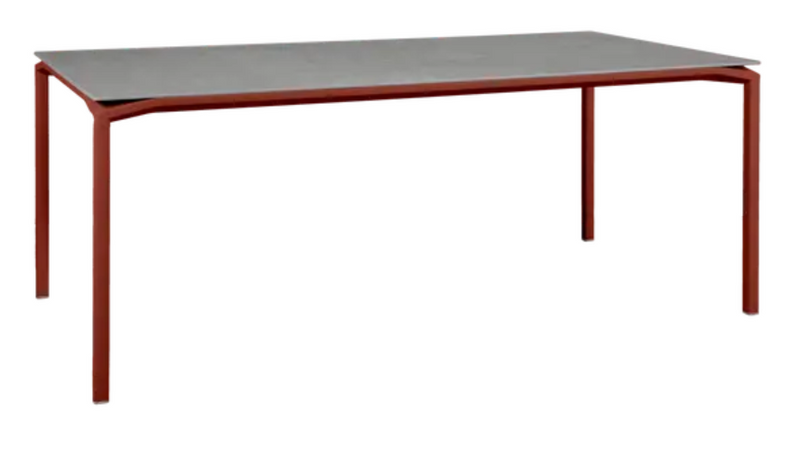 Load image into Gallery viewer, Fermob CALVI Kreta mineral dining table in red ochre, 195 x 95 cm, eight-seater with durable stone tabletop.
