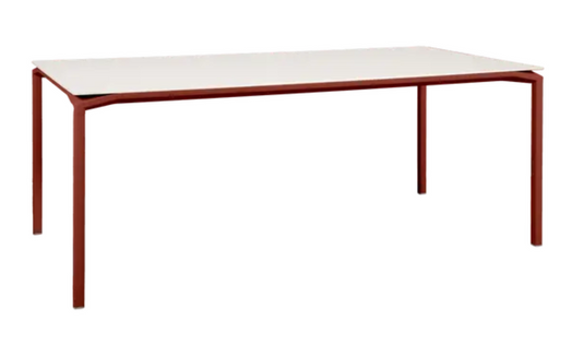 Red ochre Fermob CALVI AERIS mineral dining table with an eight-seater table top, 195 x 95 cm for indoor or outdoor use.