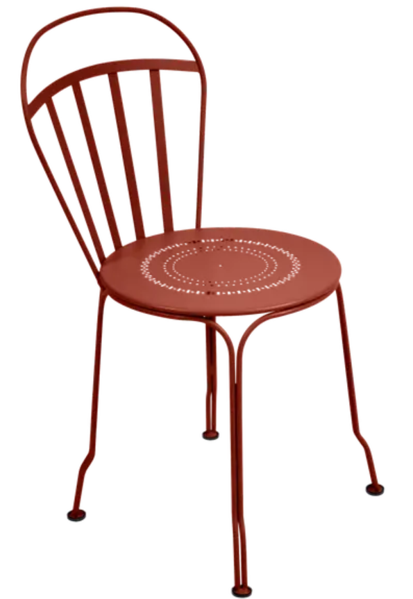 Load image into Gallery viewer, Red ochre Fermob Louvre outdoor chair with a sleek design and curved armrests, perfect for outdoor seating.
