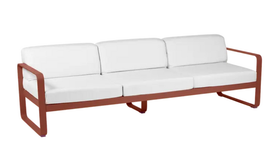 Red Ochre Fermob Bellevie 3-seater outdoor sofa with metal frame, stylishly designed for comfortable outdoor relaxation.