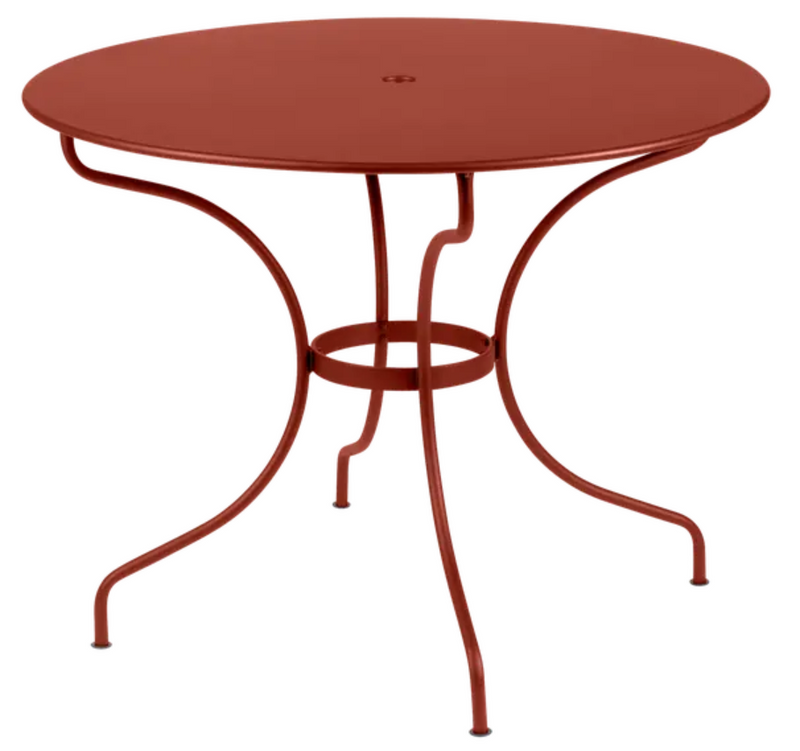 Load image into Gallery viewer, Red Ochre Fermob OPÉRA+ outdoor metal table with 96 cm diameter, suitable for five-seater patio seating.
