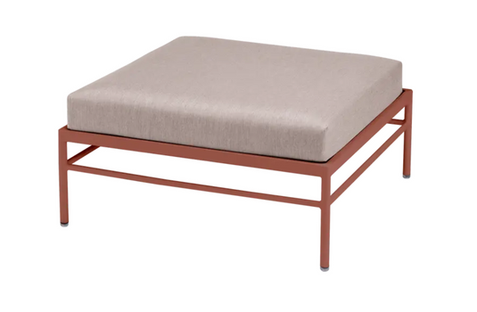 Red Ochre Fermob Rivage Ottoman outdoor furniture with metal frame, perfect for lounging and outdoor relaxation.