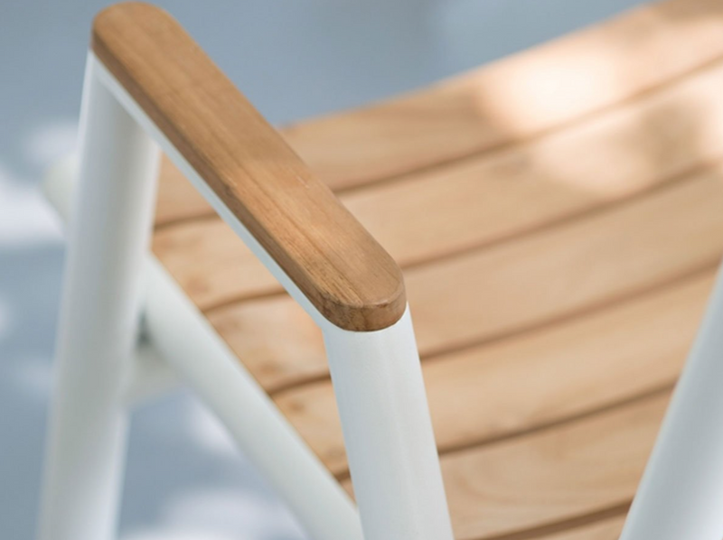Load image into Gallery viewer, Red ochre Fermob Pilotis teak outdoor armchair with low armrest, featuring solid teak construction and modern design.
