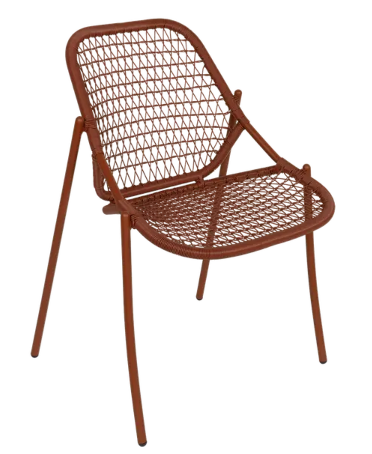 Load image into Gallery viewer, Red Ochre Fermob Sixties Stackable Chair made of knitted outdoor furniture, shown stacked and ready for outdoor use.
