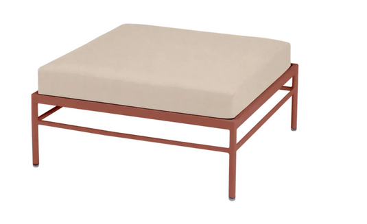 Red ochre Fermob Rivage Ottoman outdoor furniture with metal frame, ideal for lounging and relaxation.