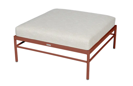 Red Ochre Fermob Rivage Ottoman outdoor furniture with wicker design and aluminum frame, perfect for relaxing outdoor spaces.