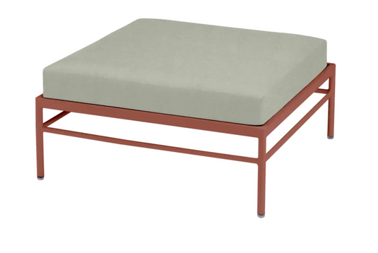 Red and ochre Rivage outdoor Ottoman by Fermob with a metal frame, featuring a stylish, comfortable lounge footstool design.