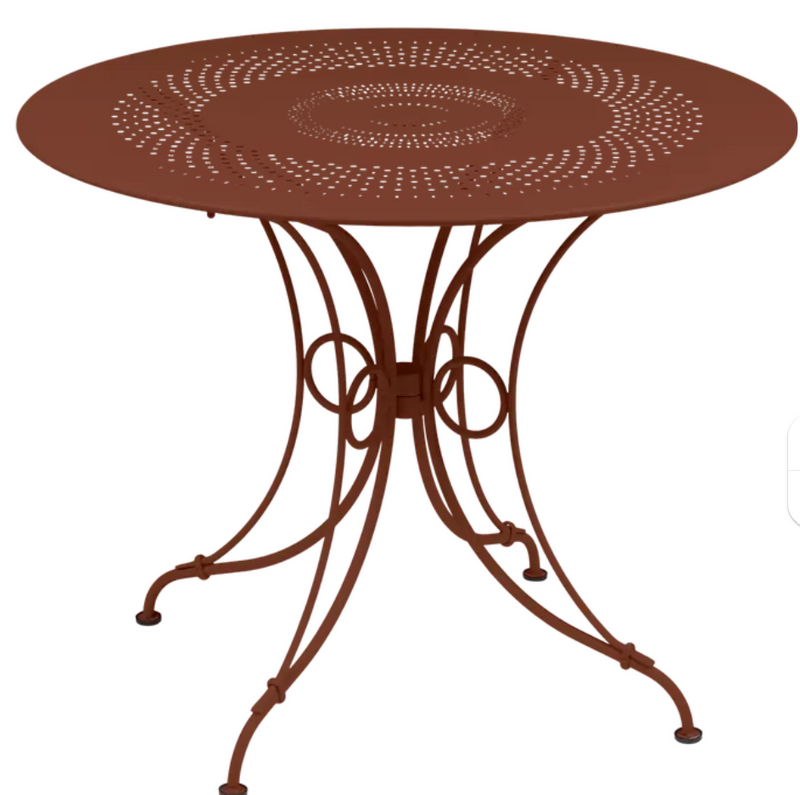 Load image into Gallery viewer, Red Fermob 1900 outdoor table with 96cm diameter, metal design, perfect for outdoor patio or garden seating.
