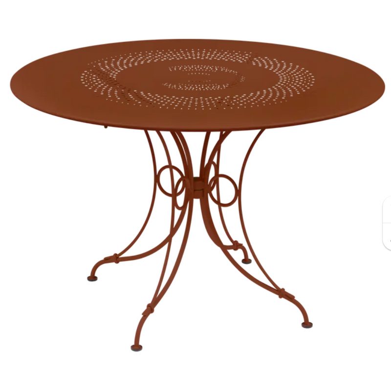Load image into Gallery viewer, Red Ochre Fermob 1900 outdoor round table with 117cm diameter, suitable for outdoor dining and garden use.

