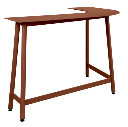 Red ochre Fermob Bolder corner bar stool with two-seater garden bench in foxed metal outdoor furniture setting.