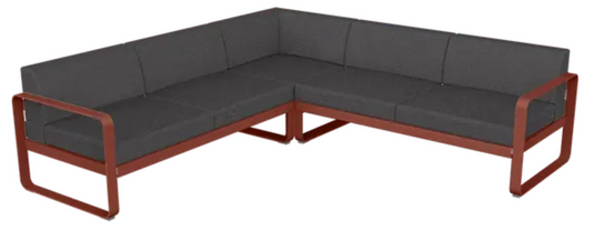 Fermob Bellevie Composition 2 outdoor sofa set with red ochre, graphite, and grey cushions on a modern modular lounge.