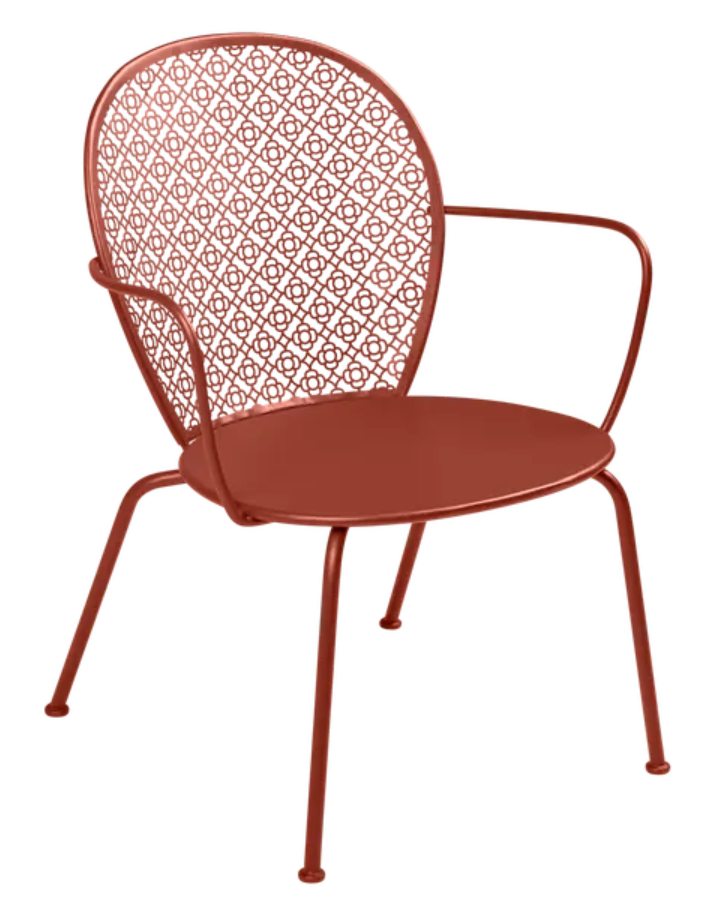 Load image into Gallery viewer, Red ochre Fermob Lorette low armchair with a metal frame, perfect for outdoor seating and stylish patio furniture.
