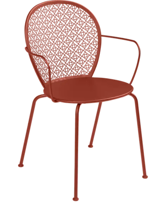 Red ochre Fermob Lorette outdoor metal armchair with a stylish, curved design perfect for garden or patio seating.
