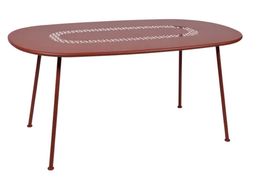 Red ochre Fermob Lorette oval metal outdoor dining table, 160 x 90 cm, sturdy and stylish for outdoor patio use.