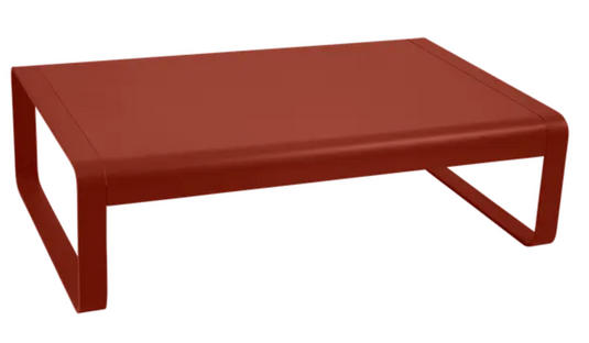 Red Fermob Bellevie low lounge table measuring 103x75 cm, outdoor metal coffee table with a sleek, modern design.