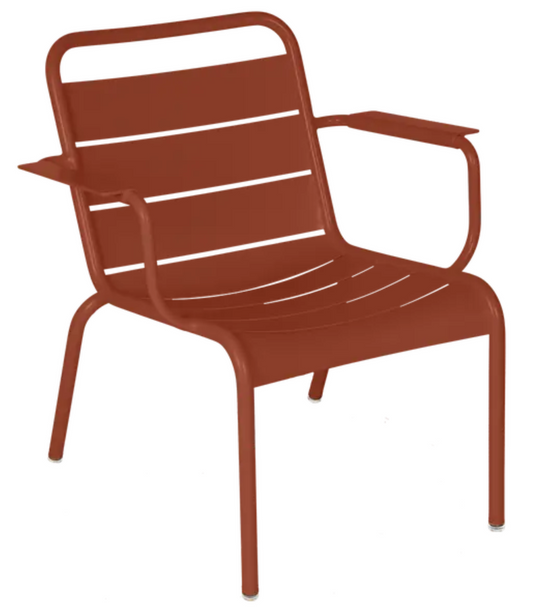 Red Ochre Fermob Luxembourg Garden Armchair Lounge with sleek design and comfortable seating for outdoor relaxation.
