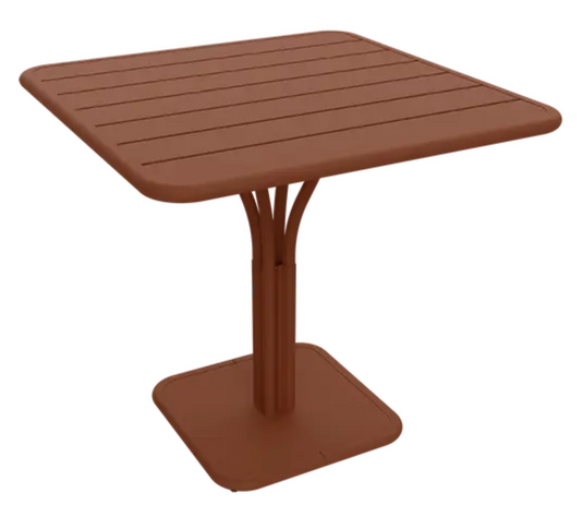 Red Ochre Fermob Luxembourg outdoor pedestal table measuring 80x80 cm, stylish and durable for outdoor dining or patio use.