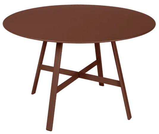 Red ochre Fermob SO'O oval oak table with 117cm diameter, ideal for restaurant or hotel settings.