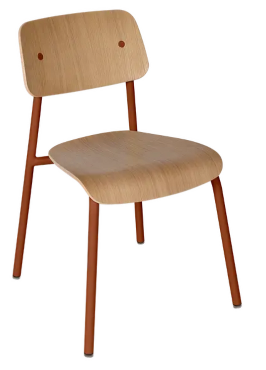 Red ochre Fermob Studie oak chair with a sleek wooden design, suitable for office, restaurant, or home use.
