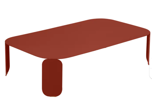Red Fermob Bebop low outdoor table, 120x70 cm with 42 cm height, stylish and modern outdoor furniture piece.