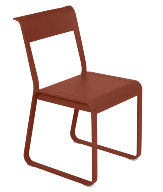 Fermob Bellevie Chair V2, red ochre metal outdoor chair with sleek modern design and curved backrest.