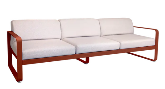 Redochre pearl Fermob Bellevie 3-seater outdoor sofa with metal frame, stylish and comfortable for outdoor patio or garden use.
