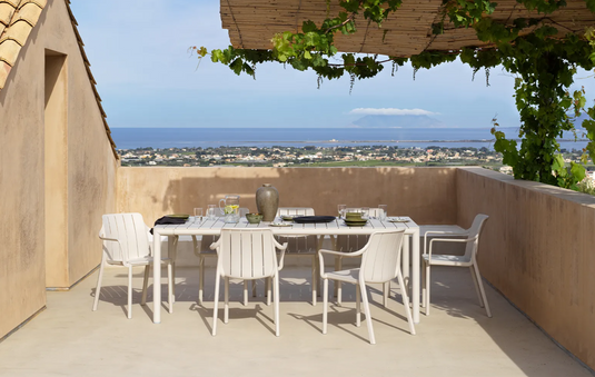 Outdoor Nardi Tevere 210 extendable table with a sleek design, suitable for garden or patio dining, shown in a vibrant outdoor setting.
