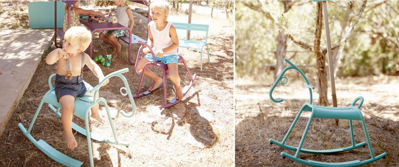 Load image into Gallery viewer, Fermob ADADA rocking horse kids corner furniture, colorful wooden rocking chair for children in a restaurant waiting area.
