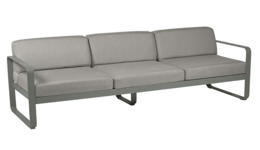 Rosemary grey taupe Fermob Bellevie 3-seater outdoor metal sofa with armrests on a patio setting.