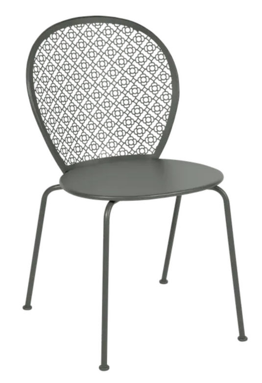 Colorful Fermob Lorette outdoor metal chair with curved armrests and slatted seat, designed for outdoor garden or patio use.