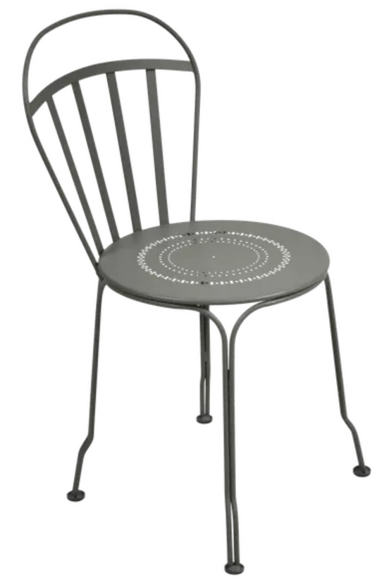 Fermob Louvre outdoor chair with a sleek design, featuring a metal frame and slatted seat in a vibrant color.