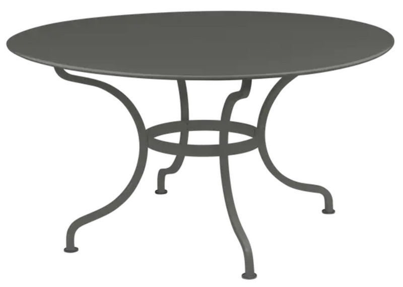 Load image into Gallery viewer, Fermob Romane round table with 137cm diameter, suitable for 8 guests, shown in a stylish outdoor patio setting.
