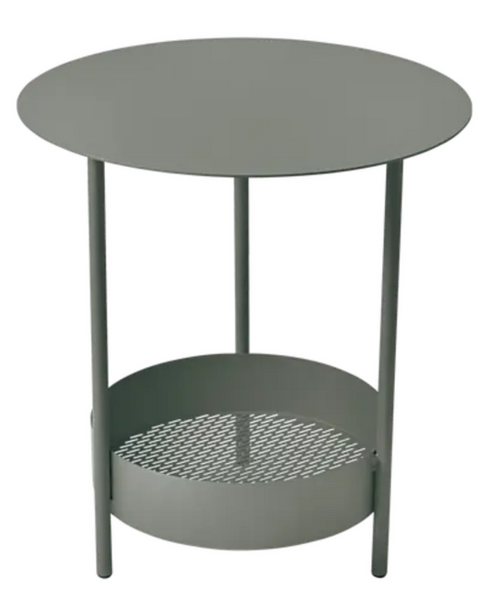 Fermob Salsa pedestal side table with round top, outdoor furniture piece in a garden setting, ideal for patio or balcony use.