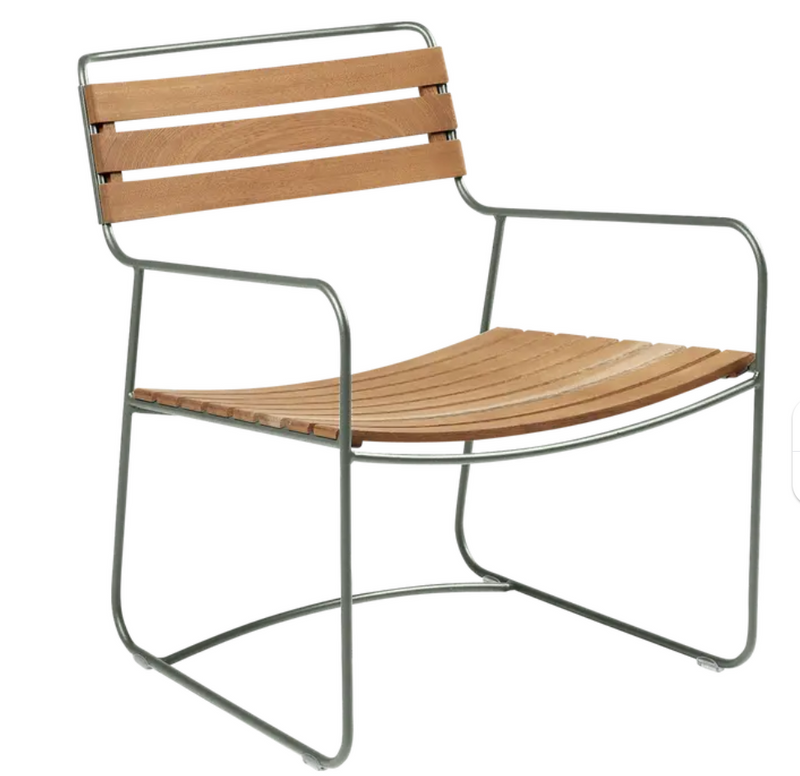 Load image into Gallery viewer, Surprising Teak Low Armchair by Fermob, outdoor metal chair with teak armrests, suitable for garden or patio seating.
