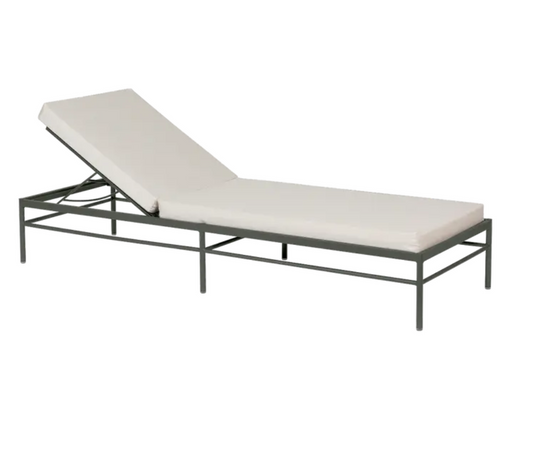 Fermob Rivage luxury metal sunlounger with woven rosemary twine details, designed for outdoor relaxation.