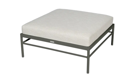 Fermob Rivage outdoor ottoman with metal frame and wicker-style rosemary finish, versatile lounge footstool for outdoor spaces.