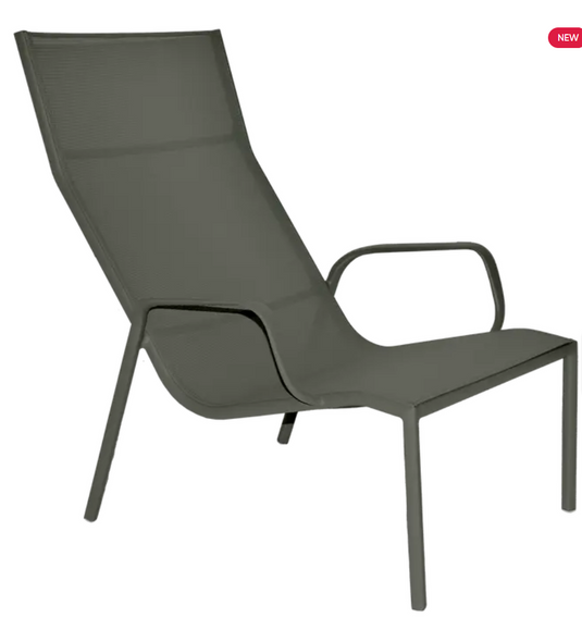 Rosemary Fermob Cadiz Lounge Armchair with woven seat and curved metal frame, designed for outdoor relaxing.