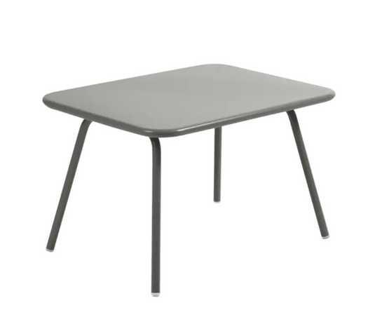 Fermob Luxembourg Kid Table, a children's table with a modern design, shown in a corner setting ideal for kids' play or activities.