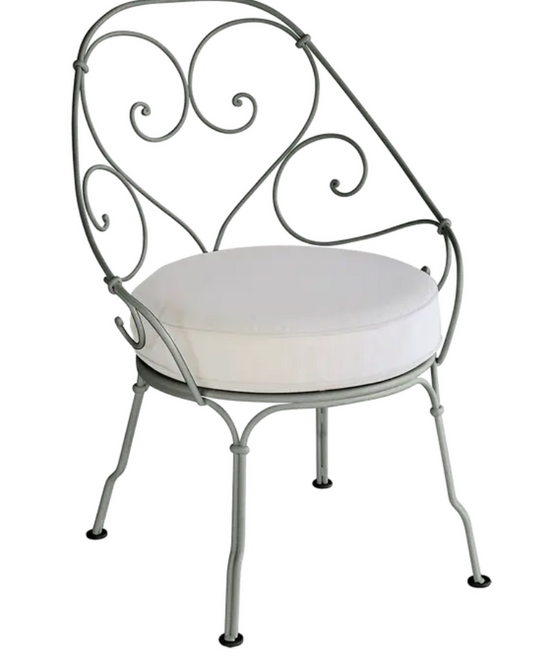 Off-white Fermob Carbriolet outdoor armchair with metal frame and armrests, ideal for garden or patio seating.