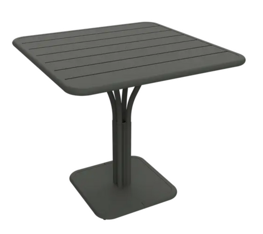 Outdoor Fermob Luxembourg Pedestal Table with an 80x80 cm round rosemary-colored tabletop and sturdy pedestal base.