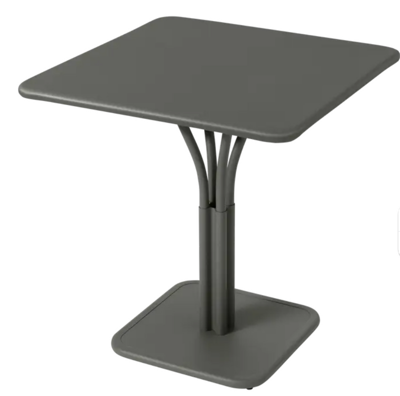 Load image into Gallery viewer, Fermob Luxembourg metal outdoor table with a solid top, 71x71 inches, suitable for patio or restaurant seating.
