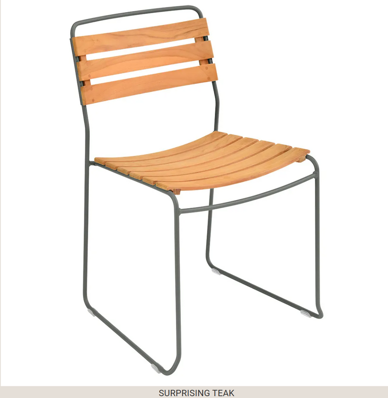 Load image into Gallery viewer, Fermob outdoor metal chair with a surprising teak seat, designed for comfortable outdoor seating in a garden or patio setting.

