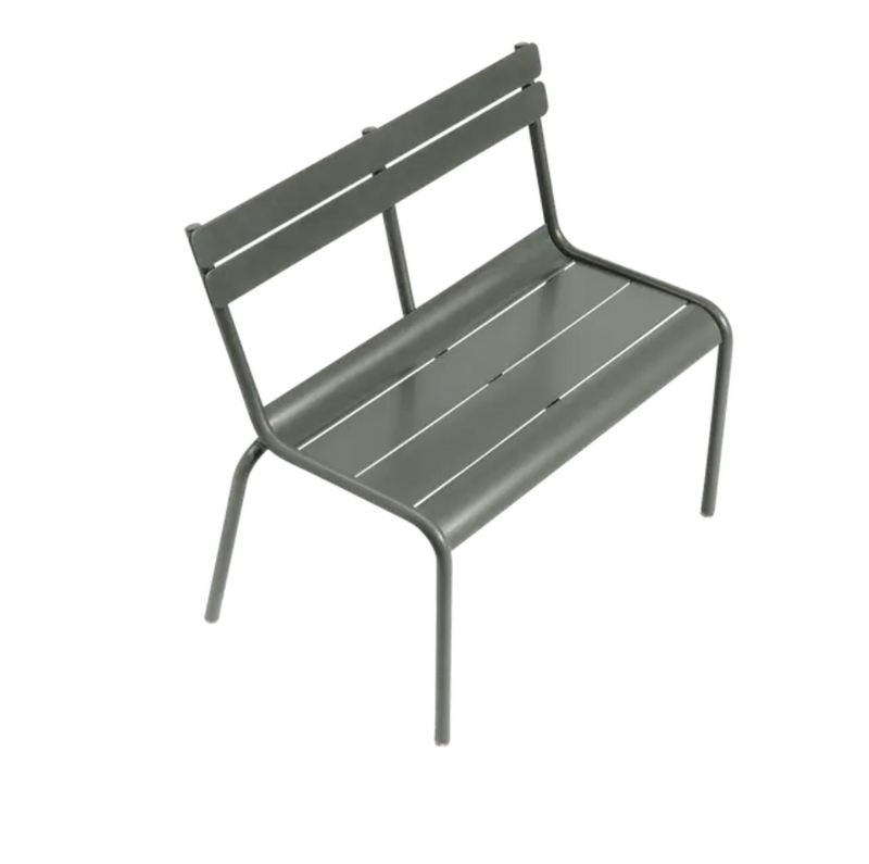 Load image into Gallery viewer, Fermob Luxembourg Kid Bench featuring a colorful, curved design, suitable for children's seating in a restaurant or outdoor setting.
