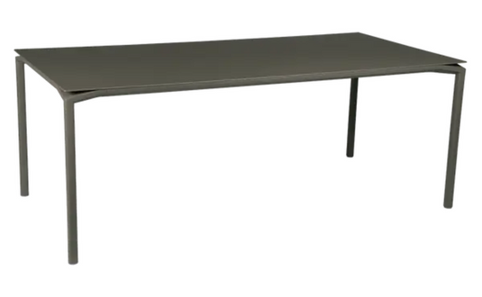 Rectangular Fermob Calvi outdoor dining table, 195x95 cm, eight-seater, featuring a sleek design for indoor or outdoor use.